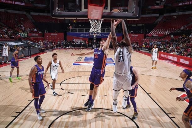 Udoka Azubuike of the Utah Jazz White drives to the basket during the game against the Phoenix Suns during the 2021 Las Vegas Summer League on August...