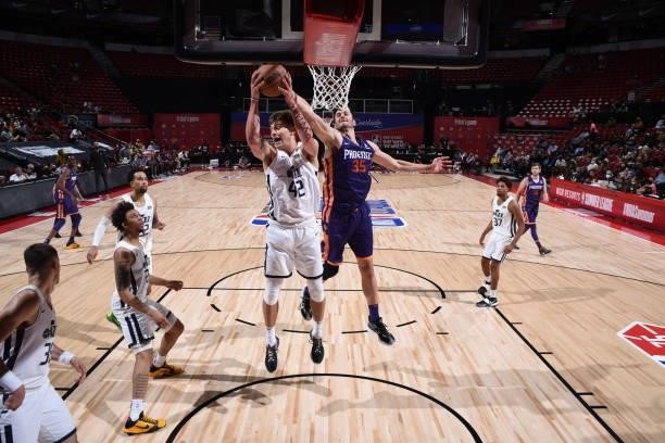 Nate Sestina of the Utah Jazz rebounds during the game against the Phoenix Suns during the 2021 Las Vegas Summer League on August 9, 2021 at the...