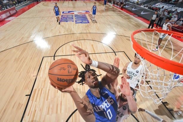 Daniel Oturu of the LA Clippers drives to the basket against the Milwaukee Bucks during the 2021 Las Vegas Summer League on August 9, 2021 at the Cox...