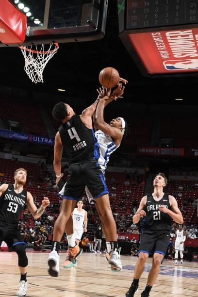 Jalen Suggs of the Orlando Magic blocks the ball against Moses Moody of the Golden State Warriors during the 2021 Las Vegas Summer League on August...