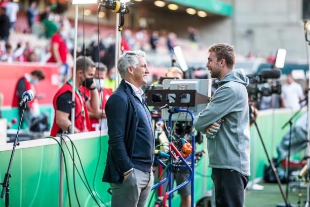 Bastain Schweinsteiger talks to Christoph Kramer of Borussia Moenchengladbach ahead the first Round DFB-Cup match between 1. FC Kaiserslautern and...