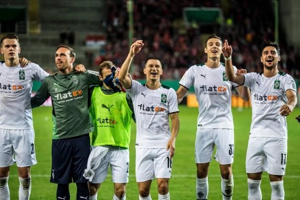 The Team of Borussia Moenchengladbach celebrate their victory after the first Round DFB-Cup match between 1. FC Kaiserslautern and Borussia...