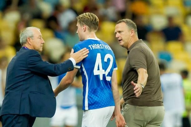 Kristian Thorstvedt of KRC Genk and head coach John van den Brom of KRC Genk gesture during the UEFA Champions League 2021-22 third qualifying round...