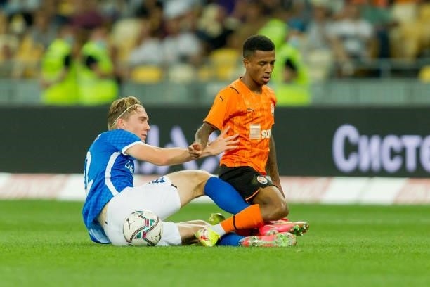 Kristian Thorstvedt of KRC Genk and Vitao of Shakhtar Donetsk battle for the ball during the UEFA Champions League 2021-22 third qualifying round 2nd...