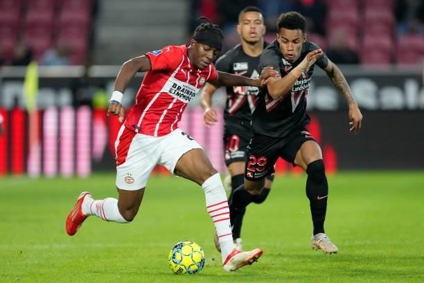 Noni Madueke of PSV, Paulinho of FC Midtjylland during the UEFA Champions League match between FC Midtjylland v PSV at the Arena Herning on August...