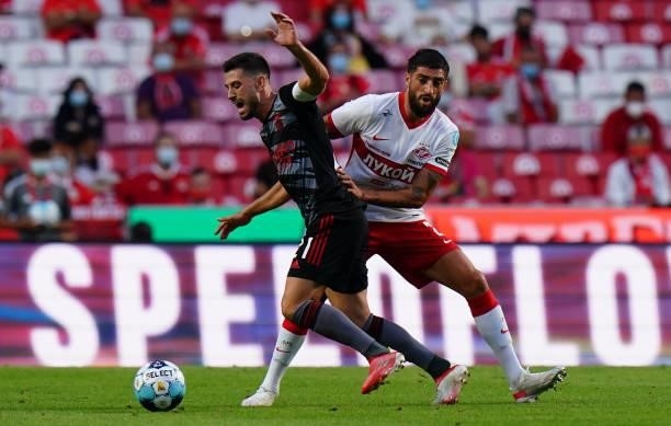 Pizzi of SL Benfica with Samuel Gigot of Spartak Moskva in action during the UEFA Champions League Third Qualifying Round Leg Two match between SL...