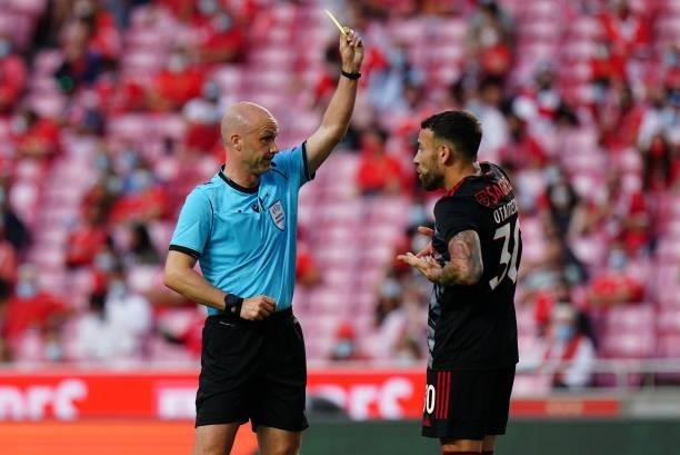 Referee Anthony Taylor shows yellow card to Nicolas Otamendi of SL Benfica during the UEFA Champions League : Third Qualifying Round Leg Two match...
