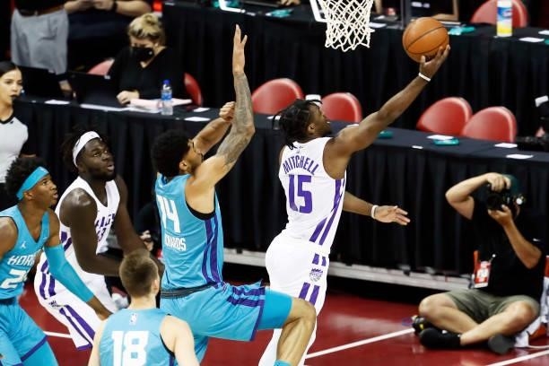 Davion Mitchell of the Sacramento Kings drives to the basket against the Charlotte Hornets during the 2021 Las Vegas Summer League on August 9, 2021...