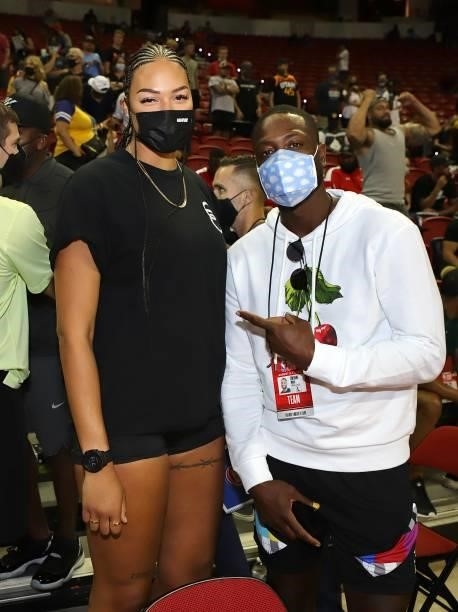 Liz Cambage of the Las Vegas Aces poses for a photo with Dwayne Wade during the 2021 Las Vegas Summer League on August 9, 2021 at the Cox Pavilion in...