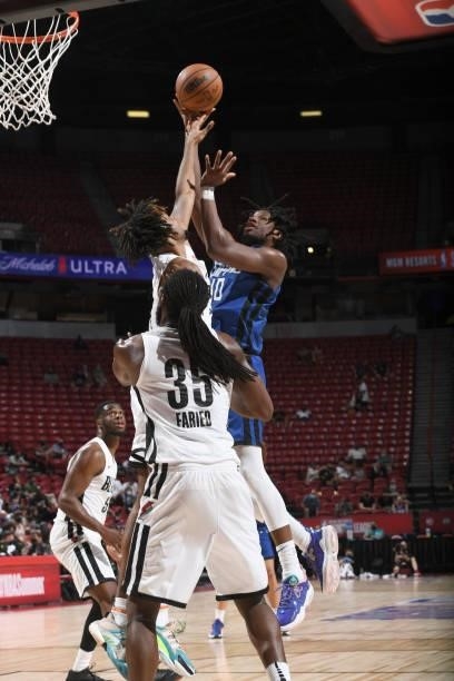 Daniel Oturu of the LA Clippers drives to the basket against the Portland Trail Blazers during the 2021 Las Vegas Summer League on August 10, 2021 at...