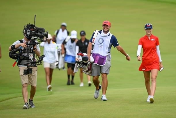 Saitama , Japan - 7 August 2021; Nelly Korda of United States and caddy Jason McDede on the 18th during round four of the women's individual stroke...