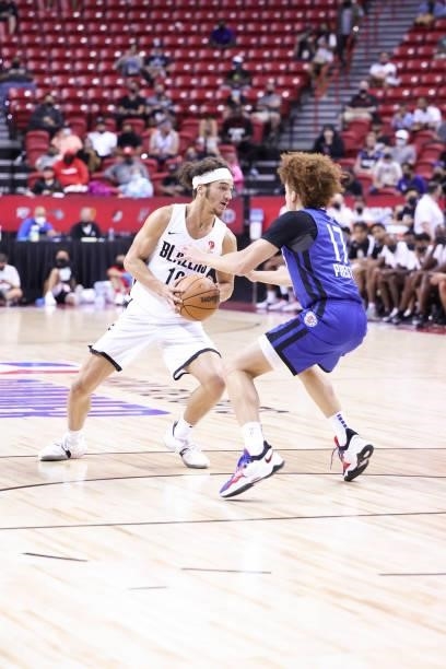 Elleby of the Portland Trail Blazers handles the ball as Jason Preston of the LA Clippers plays defense during the 2021 Las Vegas Summer League on...