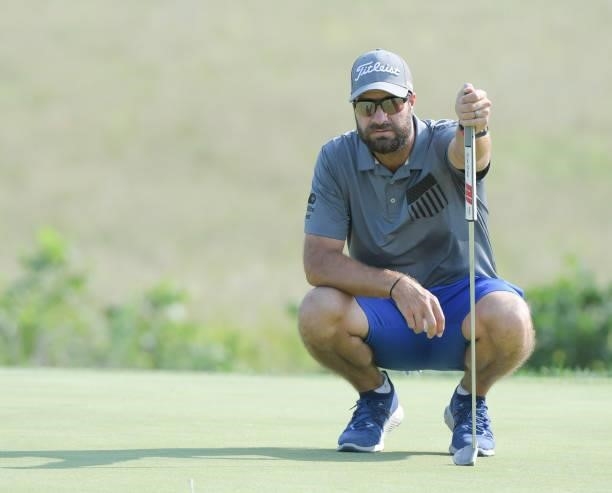 Tom Whitney studies his putt on the first green prior to the Korn Ferry Tours Pinnacle Bank Championship presented by Aetna at The Club at Indian...