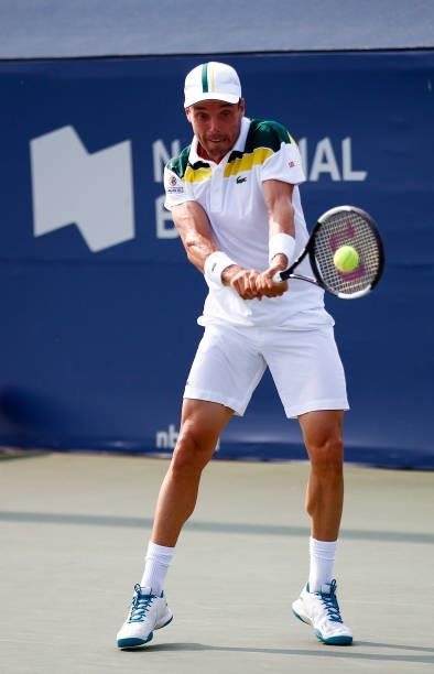 Roberto Bautista Agut of Spain hits a shot against Tommy Paul of the United States during the second round on Day Three of the National Bank Open at...