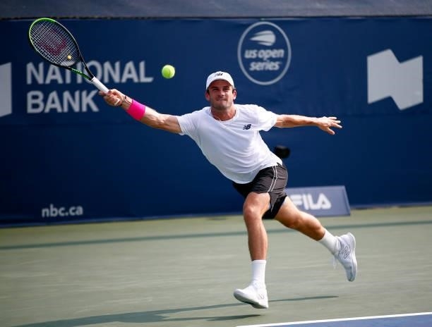 Tommy Paul of the United States hits a shot against Roberto Bautista Agut of Spain during the second round on Day Three of the National Bank Open at...