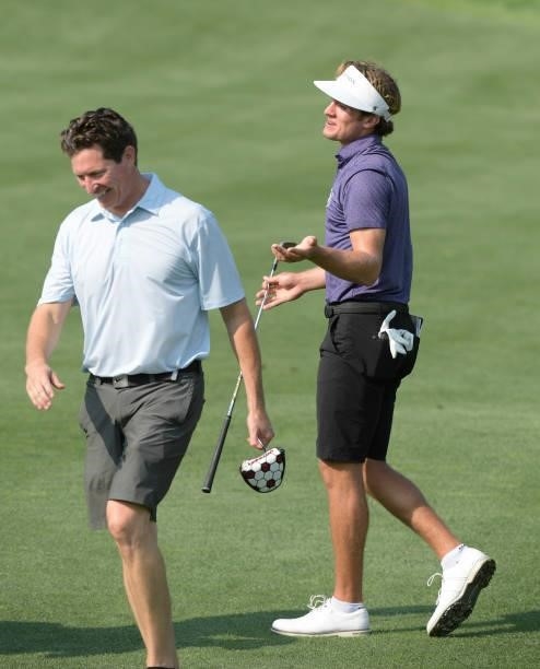 James Nicholas celebrates his chip in from the first fairway with his Pro-Am partner prior to the Korn Ferry Tours Pinnacle Bank Championship...