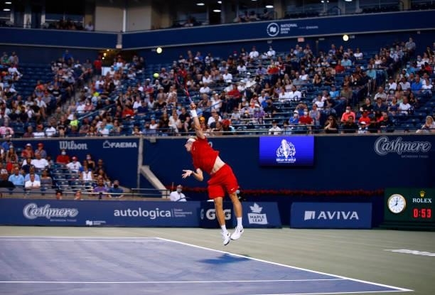 Denis Shapovalov of Canada serves against Frances Tiafoe of the United States during the second round on Day Three of the National Bank Open at Aviva...