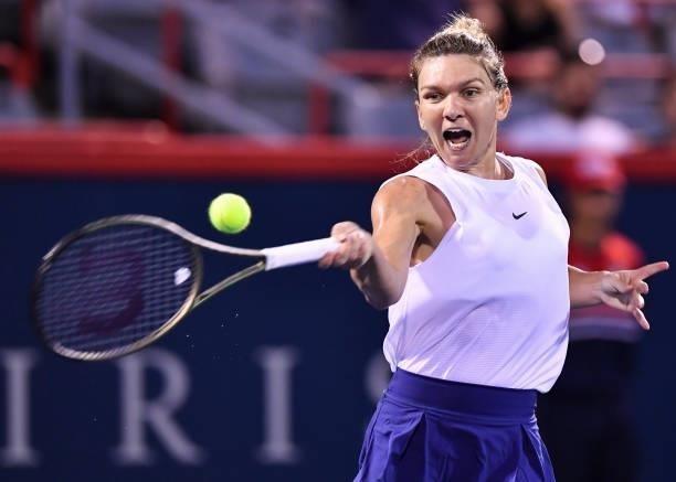 Simona Halep of Romania hits a return during her Women's Singles second round match against Danielle Collins of the United States on Day Three of the...