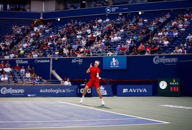 Denis Shapovalov of Canada hits a shot against Frances Tiafoe of the United States during the second round on Day Three of the National Bank Open at...