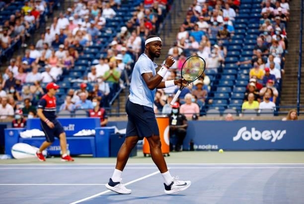 Frances Tiafoe of the United States celebrates a point against Denis Shapovalov of Canada during the second round on Day Three of the National Bank...