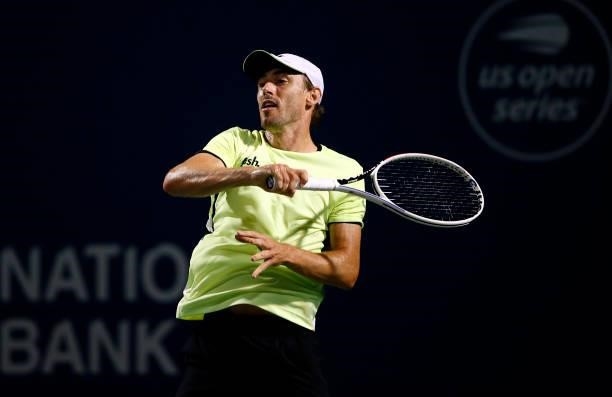 John Millman of Australia hits a shot against Gael Monfils of France during the second round on Day Three of the National Bank Open at Aviva Centre...