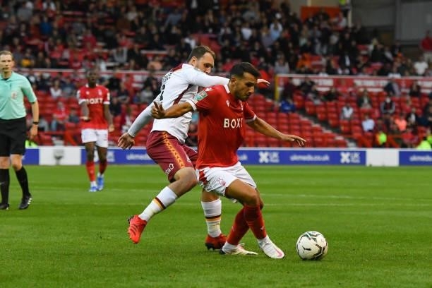 Joao Carvalho of Nottingham Forest shields the ball from Callum Cooke of Bradford City during the Carabao Cup match between Nottingham Forest and...