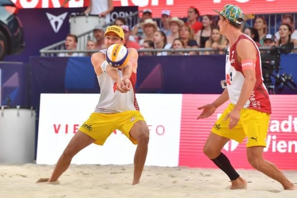Robin Valentin Seidl of Austria digs during the pool match between Christian Sandlie Sorum and Anders Berntsen Mol of Norway and Robin Valentin Seidl...