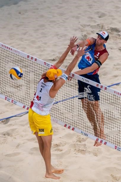 Anders Berntsen Mol of Norway spikes the ball during the pool match between Christian Sandlie Sorum and Anders Berntsen Mol of Norway and Robin...