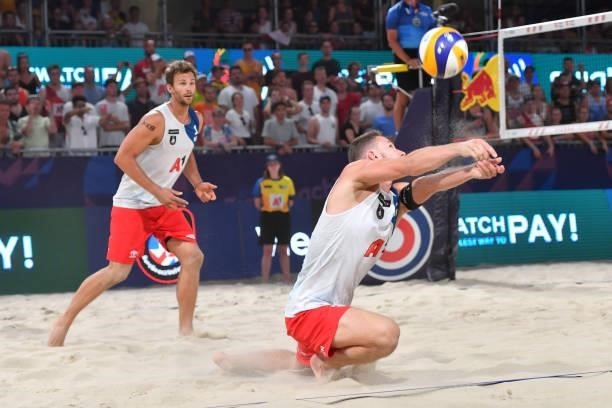 Yves Haussener of Switzerland digs during the pool match between Marco Krattiger and Yves Haussener of Switzerland and Clemens Doppler and Alexander...