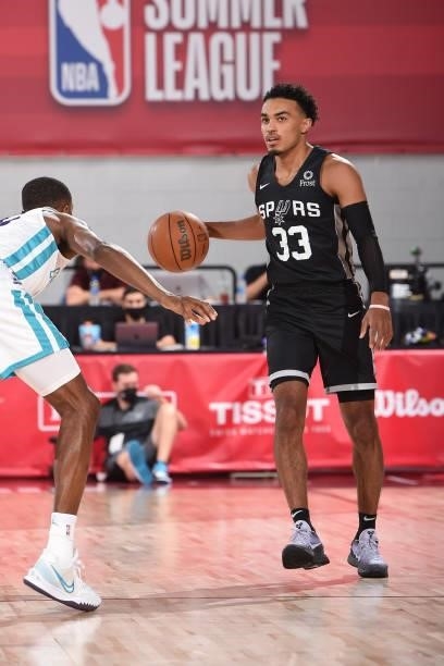 Tre Jones of the San Antonio Spurs dribbles the ball against the Charlotte Hornets during the 2021 Las Vegas Summer League on August 12, 2021 at the...