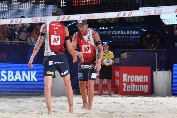 Clemens Doppler of Austria and Alexander Horst of Austria celebrate a point during the pool match between Marco Krattiger and Yves Haussener of...