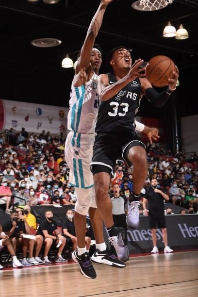 Tre Jones of the San Antonio Spurs drives to the basket against the Charlotte Hornets during the 2021 Las Vegas Summer League on August 12, 2021 at...