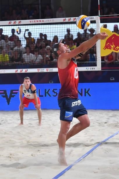 Alexander Horst of Austria digs during the pool match between Marco Krattiger and Yves Haussener of Switzerland and Clemens Doppler and Alexander...