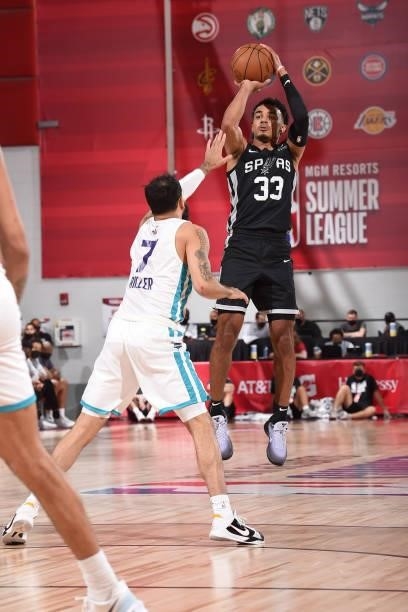 Tre Jones of the San Antonio Spurs shoots a three point basket against the Charlotte Hornets during the 2021 Las Vegas Summer League on August 12,...