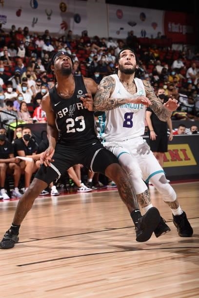 Malik Newman of the San Antonio Spurs plays defense on LiAngelo Ball of Charlotte Hornets during the 2021 Las Vegas Summer League on August 12, 2021...