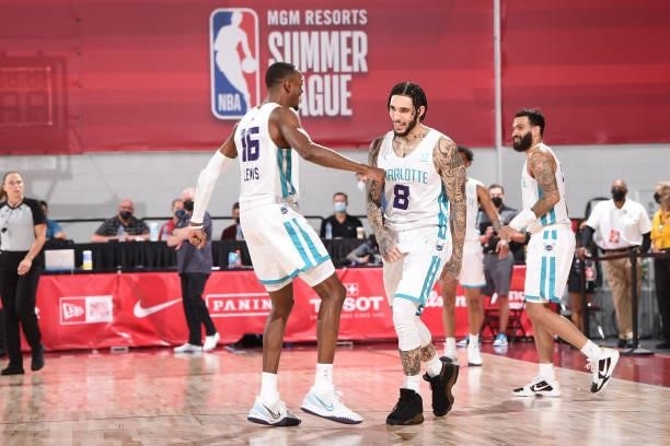 Scottie Lewis of Charlotte Hornets high fives LiAngelo Ball of Charlotte Hornets during the 2021 Las Vegas Summer League on August 12, 2021 at the...