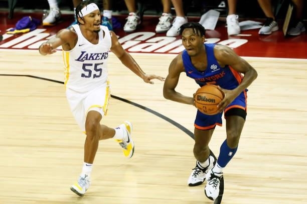 Immanuel Quickley of the New York Knicks looks to pass the ball against the Los Angeles Lakers during the 2021 Las Vegas Summer League on August 11,...
