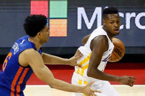 Joel Ayayi of the Los Angeles Lakers dribbles the ball against the New York Knicks during the 2021 Las Vegas Summer League on August 11, 2021 at the...