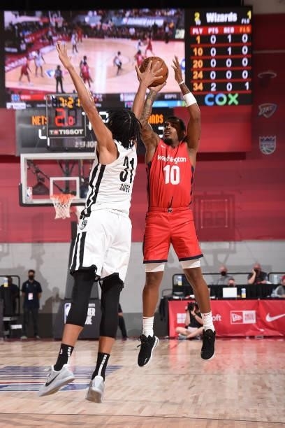 Xavier Rathan-Mayes of the Washington Wizards shoots a three point basket against the Brooklyn Nets during the 2021 Las Vegas Summer League on August...
