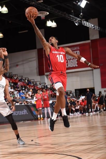 Xavier Rathan-Mayes of the Washington Wizards drives to the basket against the Brooklyn Nets during the 2021 Las Vegas Summer League on August 12,...