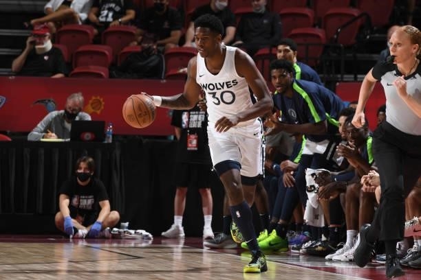 Nathan Knight of the Minnesota Timberwolves handles the ball against the Chicago Bulls during the 2021 Las Vegas Summer League on August 12, 2021 at...