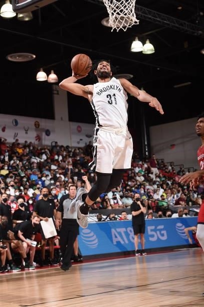 Kaiser Gates of the Brooklyn Nets drives to the basket against the Washington Wizards during the 2021 Las Vegas Summer League on August 12, 2021 at...