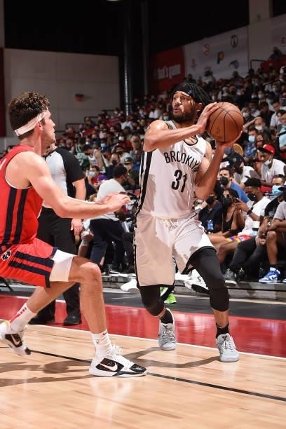 Kaiser Gates of the Brooklyn Nets looks to pass the ball against the Washington Wizards during the 2021 Las Vegas Summer League on August 12, 2021 at...