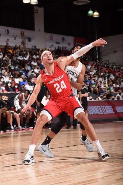 Corey Kispert of the Washington Wizards plays defense on Kaiser Gates of the Brooklyn Nets during the 2021 Las Vegas Summer League on August 12, 2021...