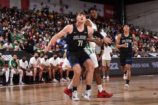 Asbjorn Midtgaard of the Orlando Magic and Bruno Fernando of the Boston Celtics fight for position during the 2021 Las Vegas Summer League on August...