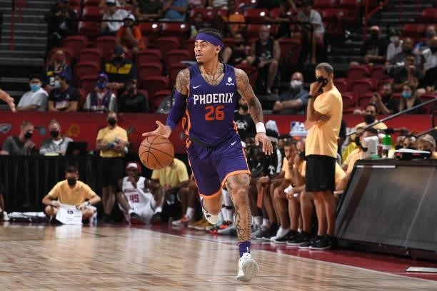 Nate Mason of the Phoenix Suns dribbles the ball against the Denver Nuggets during the 2021 Las Vegas Summer League on August 12, 2021 at the Thomas...
