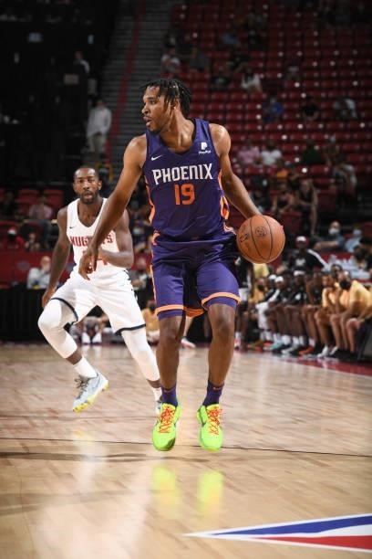Justin Simon of the Phoenix Suns handles the ball during the game against the Denver Nuggets during the 2021 Las Vegas Summer League on August 12,...
