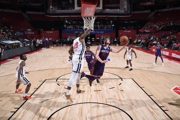 Jon Axel Gudmundsson of the Phoenix Suns drives to the basket against the Denver Nuggets during the 2021 Las Vegas Summer League on August 12, 2021...