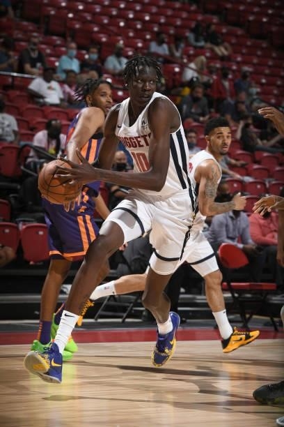 Bol Bol of the Denver Nuggets dribbles the ball against the Phoenix Suns during the 2021 Las Vegas Summer League on August 12, 2021 at the Thomas &...