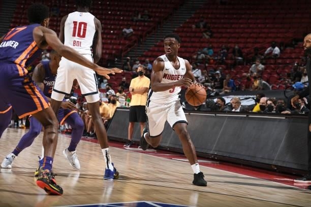 Caleb Agada of the Denver Nuggets handles the ball during the game against the Phoenix Suns during the 2021 Las Vegas Summer League on August 12,...